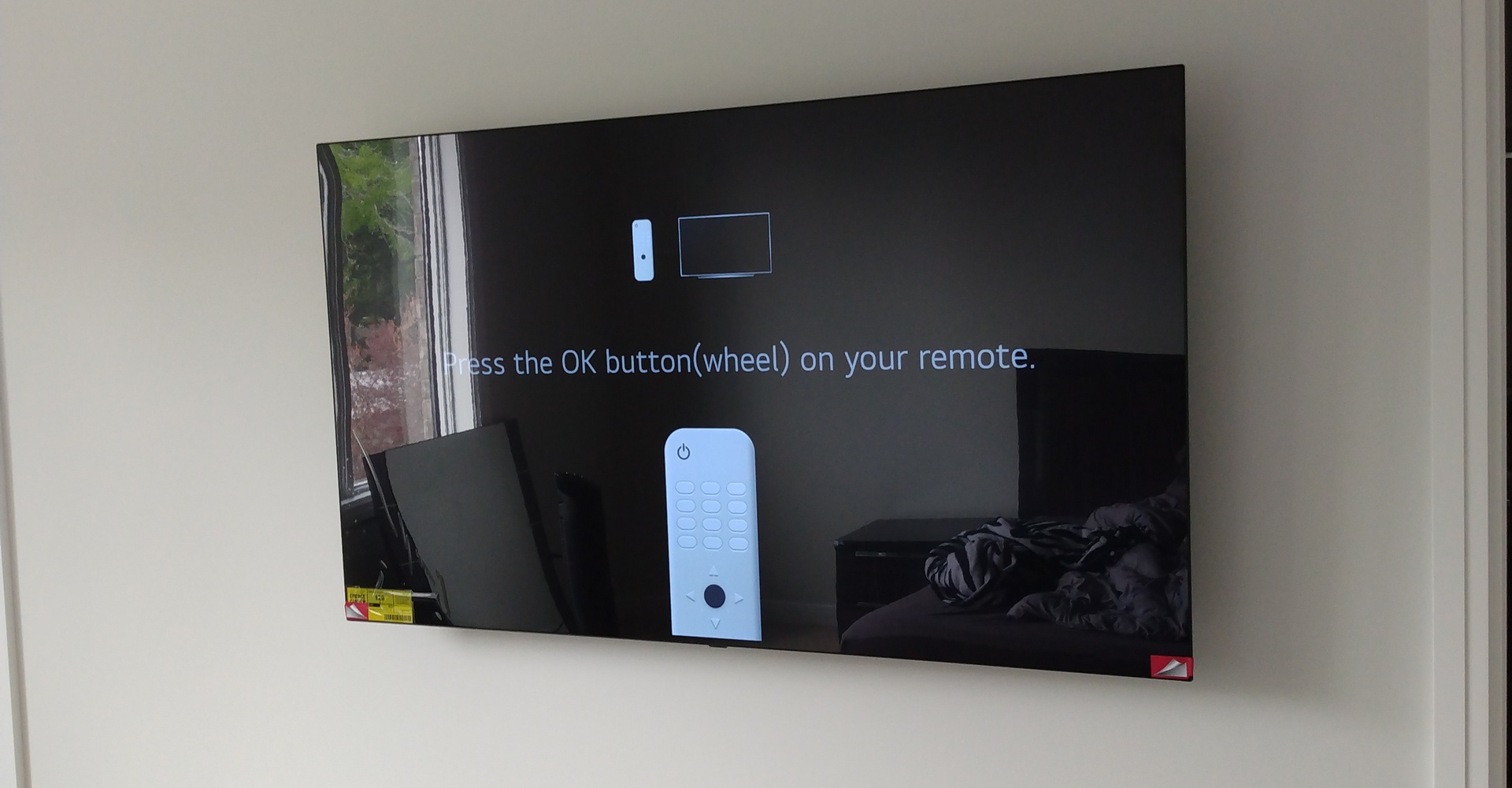 Big TV mounted on the wall with in-wall wiring.