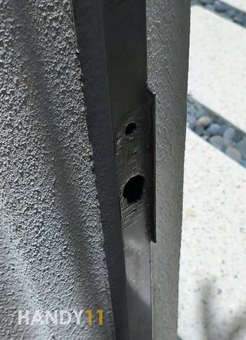 Grey metal door frame repaired.
