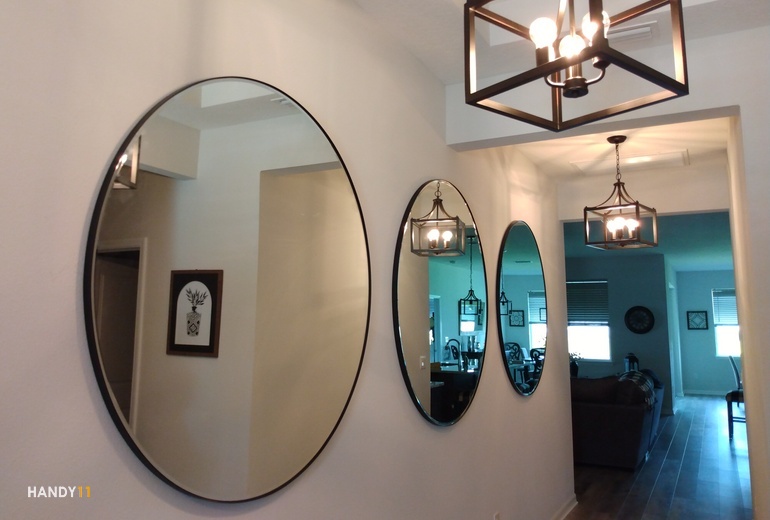 3 round mirrors on wall in the house/appartment
