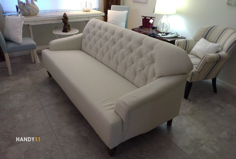Beige soft sofa assembled.