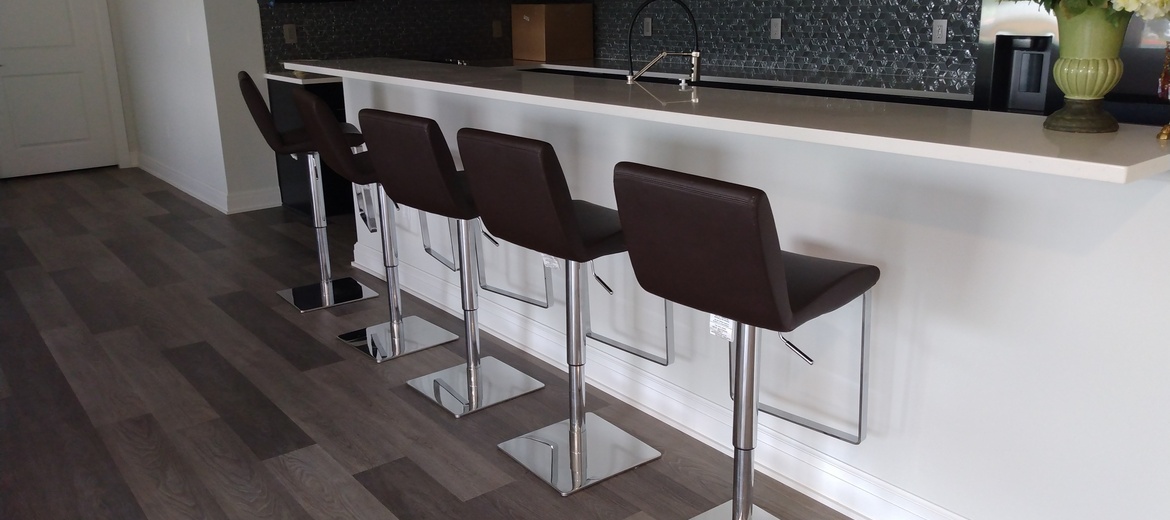 5 barstools in a row in the kitchen.