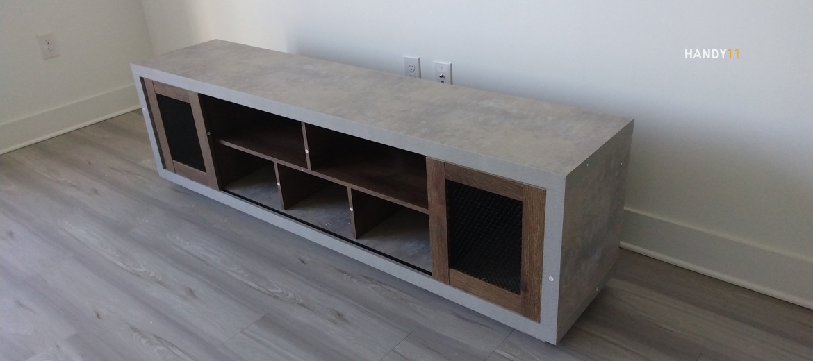 Grey-brown TV stand assembled.