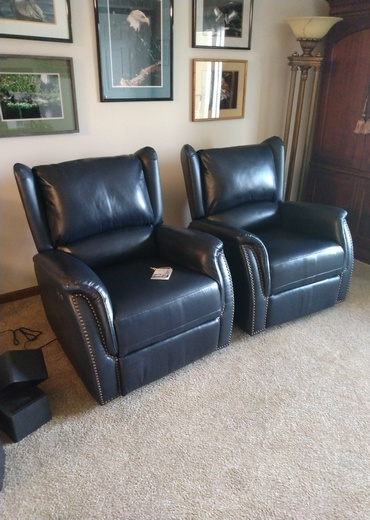 2 dark blue leather chairs assembled.