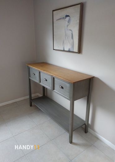 Brown-grey wood desk assembled.