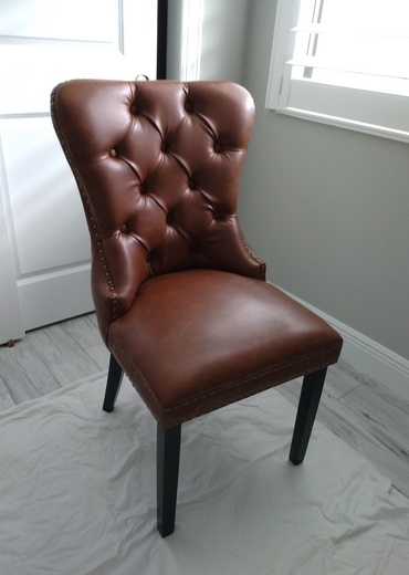Brown leather chair assembled.