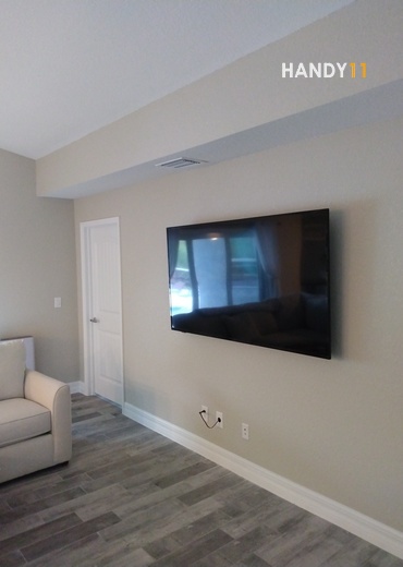 TV mounted on drywall and wires in-wall.