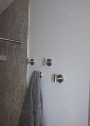 Bathroom hooks hanged in bathroom.