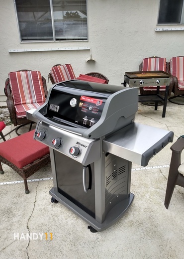 Spirit-e-210 / e-310 Grill assembly.  Outdoor furniture and grill in lanai / florida room.
